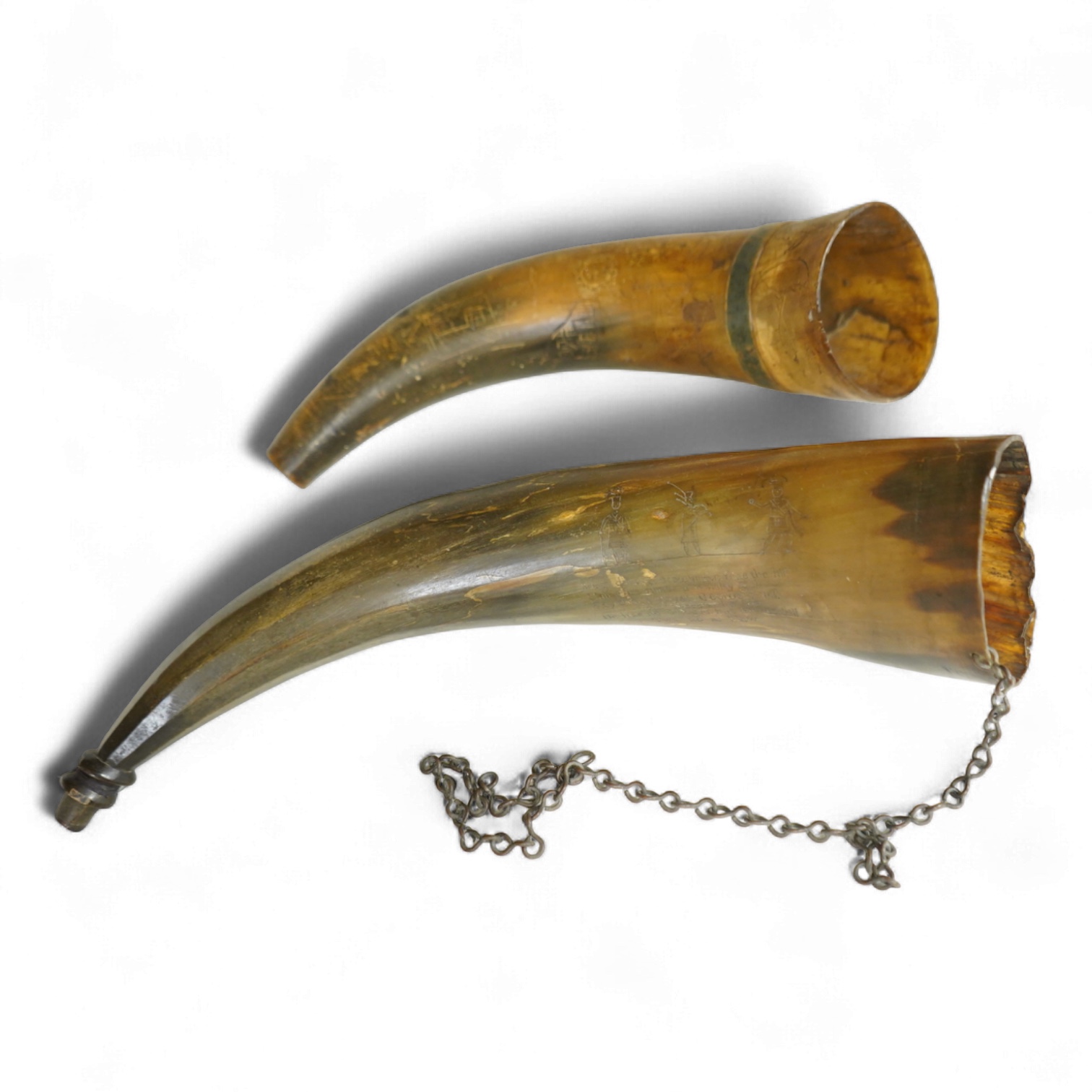 Two scrimshaw engraved cowhorn flasks the first engraved with ships, plants, fish, an anchor, a watering can and various other implements, the second engraved with a Scottish sentimental verse and the owner’s name; D. Fi